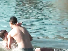Teen gay boyfriends are swimming in lake nude
